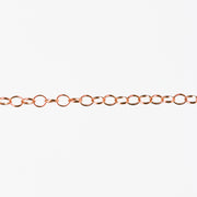 Round linked rose gold chain on a white background