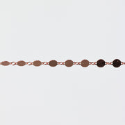Bracelet with circular links on a light gray background