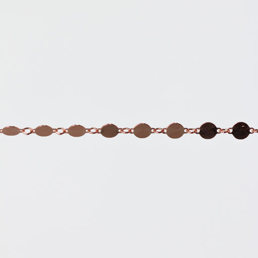Bracelet with circular links on a light gray background