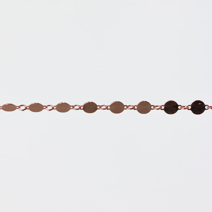 Bracelet with circular links on a light gray background