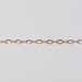 Shiny yellow gold filled chain on a light gray background
