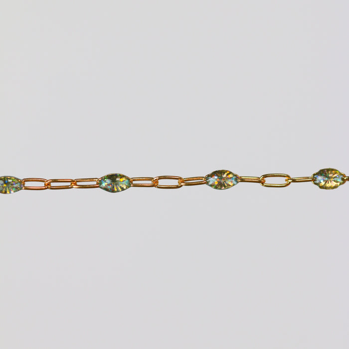 Gold cable chain for permanent jewelry with opal colored enamel on it's cable links.
