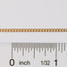 Curb chain being measured next to a ruler to show link size, spacing, and measurements