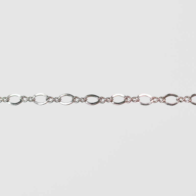 White gold infinity linked pj chain over a light gray background