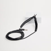 Grounded micro tipped pliers for permanent jewelry welding on a white background.