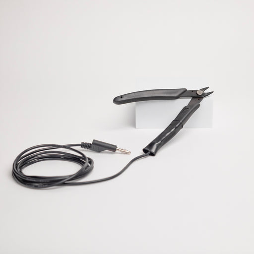 Black plier with a grounding cable for welding on a white background