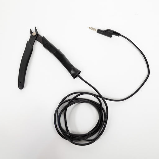 Black permanent jewelry pliers with a cable attached to ground welding electricity