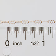 Wholesale paperclip chain laying next to a ruler for measurement
