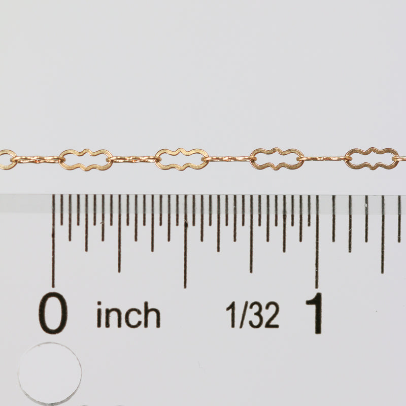 Wholesale paperclip chain laying next to a ruler for measurement