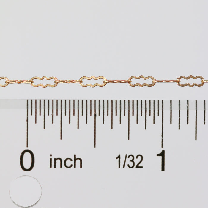 Wholesale paperclip chain laying next to a ruler for measurement