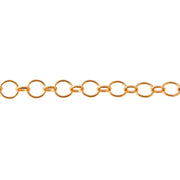 A close-up of a yellow gold filled permanent jewelry chain featuring alternating round and oval links, shown horizontally against a plain white background.