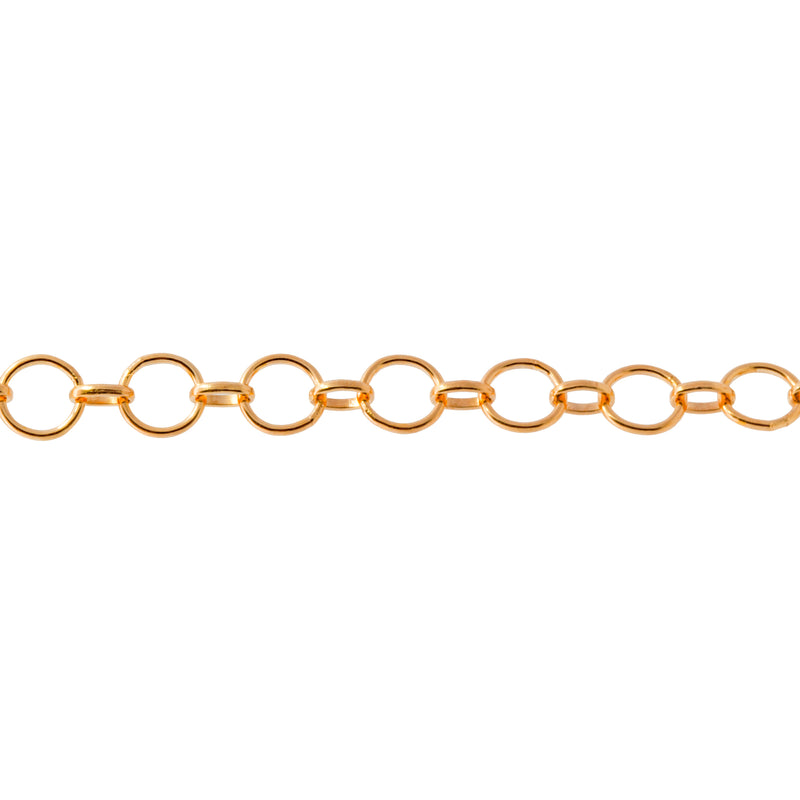 A close-up of a yellow gold filled permanent jewelry chain featuring alternating round and oval links, shown horizontally against a plain white background.