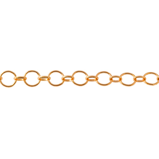 A close-up of a yellow gold filled permanent jewelry chain featuring alternating round and oval links, shown horizontally against a plain white background.