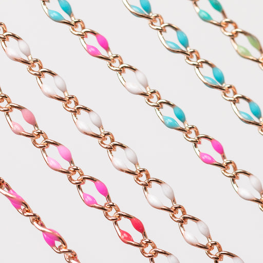 A photo with 6 chains. One chain has hot pink enamel beads. One is alternating soft pink, hot pink, pinky red, and white. One chain is all white. One chain is alternating blue, pink white. One chain is all blue. One chain is alternating blues and greens.