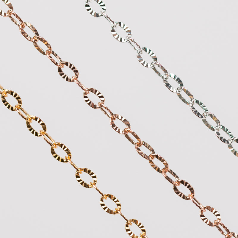 2 gold filled chains one in yellow one in rose and 1 silver chain with textured hammered oval links.