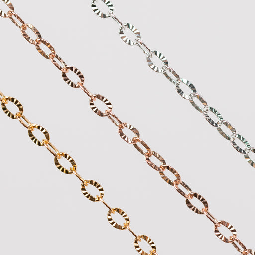 2 gold filled chains one in yellow one in rose and 1 silver chain with textured hammered oval links.