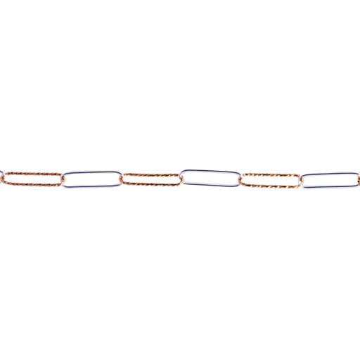 A close-up of a mixed metal chain featuring alternating elongated links, with one side in textured yellow gold and the other side in smooth silver metal, set against a plain white background.