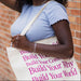 Woman holding a tote bag showcasing her permanent jewelry chain bracelet
