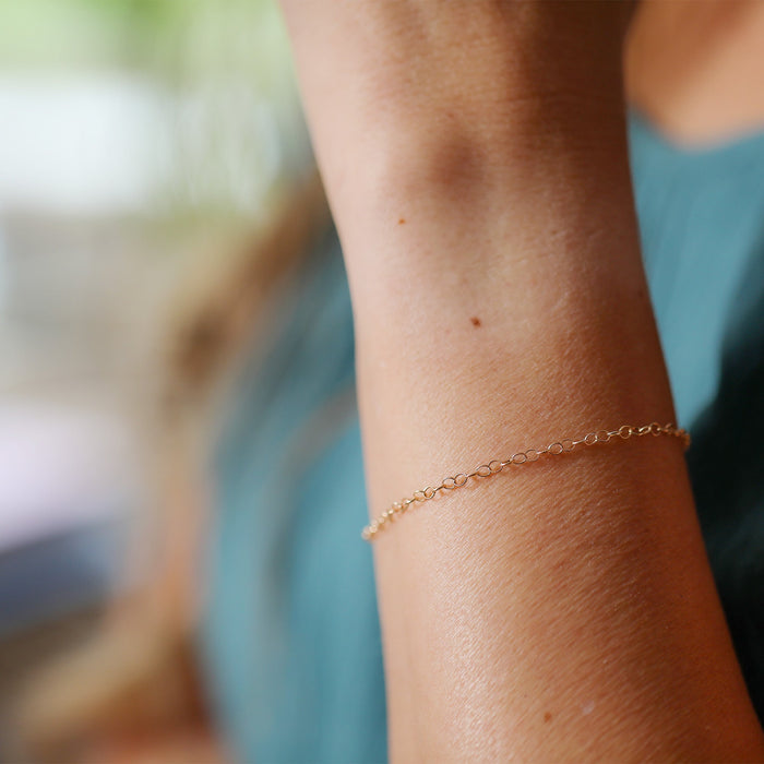 Closeup of the Lucy chain on a woman's wrist