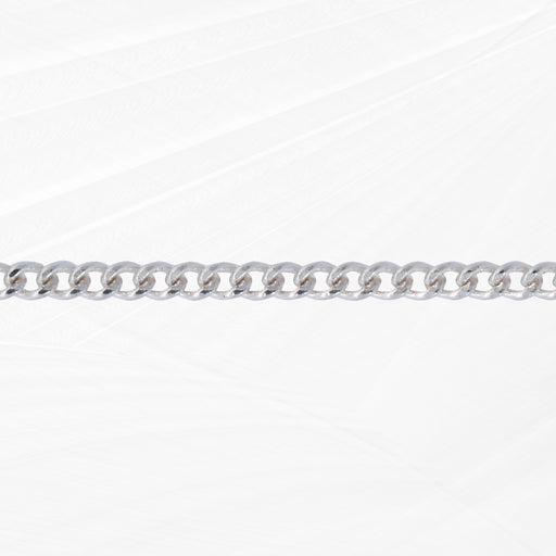 Silver chain lying flat on a white background