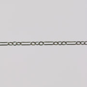 White gold chain for making permanent jewelry on a gray background