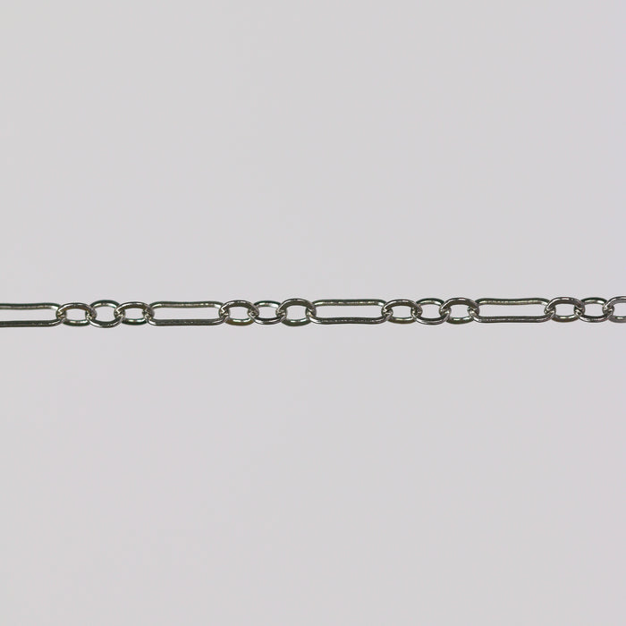 White gold chain for making permanent jewelry on a gray background