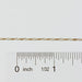 Gold chain with a ruler for scale on a white background