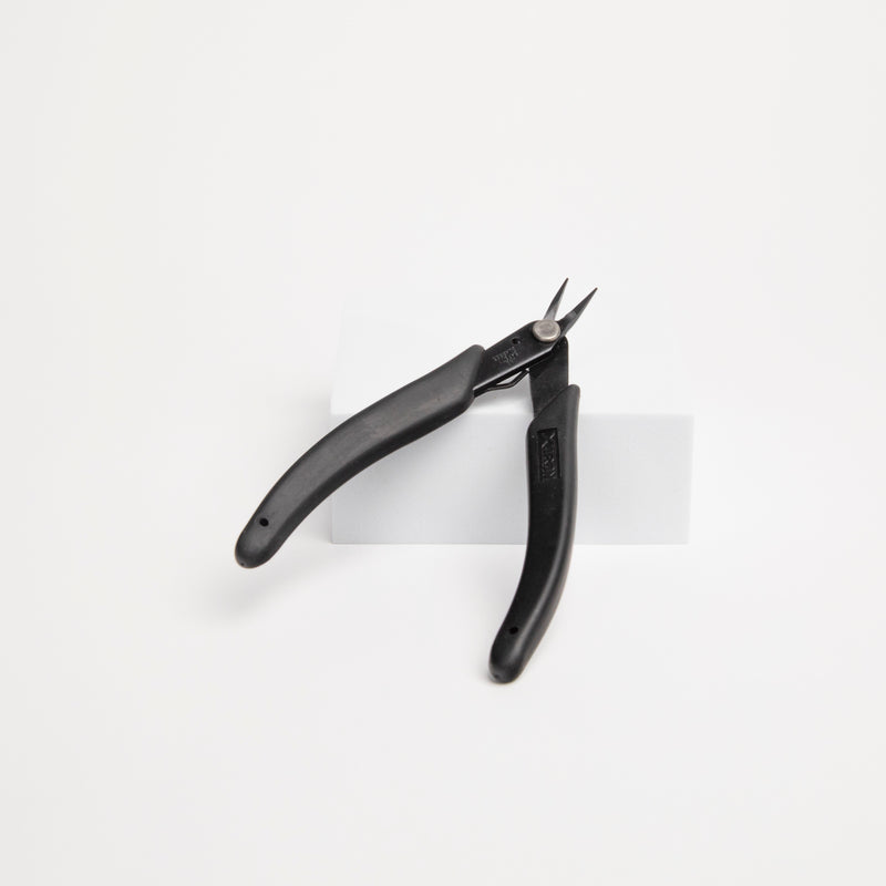 Pair of fine tipped pliers for permanent jewelry making and welding.