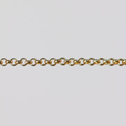 Round rolo chain for permanent jewelry over a gray background