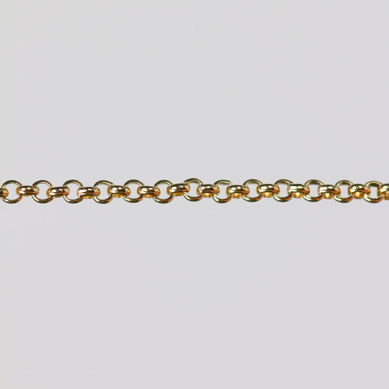Round rolo chain for permanent jewelry over a gray background