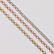 Three metal pj chains with rolo links. One in yellow gold, one in rose gold, and the last one in sterling silver.