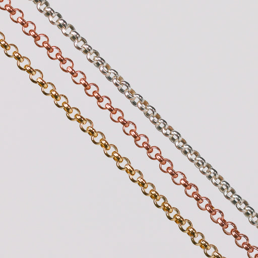 Three metal pj chains with rolo links. One in yellow gold, one in rose gold, and the last one in sterling silver.