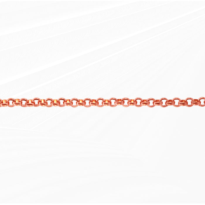Rose gold permanent jewelry chain laying on a white background horizontally