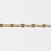 Gold starburst paperclip chain on a white background