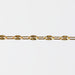 Gold starburst paperclip chain on a white background
