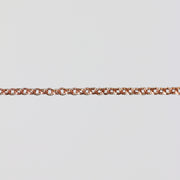 Rose gold double cable chain on a light gray background