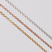 Three double cable chains, one is rose gold, one is yellow gold, and the last is silver