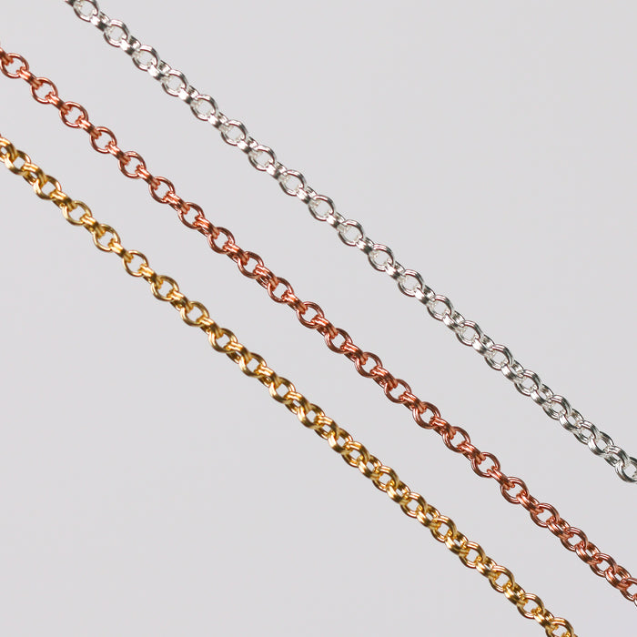 Three double cable chains, one is rose gold, one is yellow gold, and the last is silver