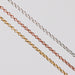 Three double cable chains, one is rose gold, one is yellow gold, and the last is silver