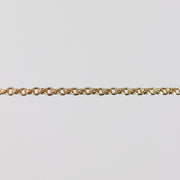 Gold double cable chain on a light gray background