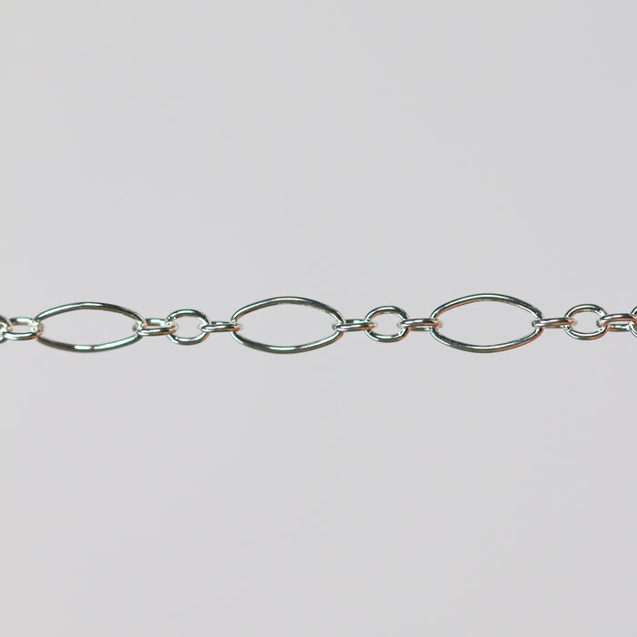Elongated oval pj chain in sterling silver on a gray background