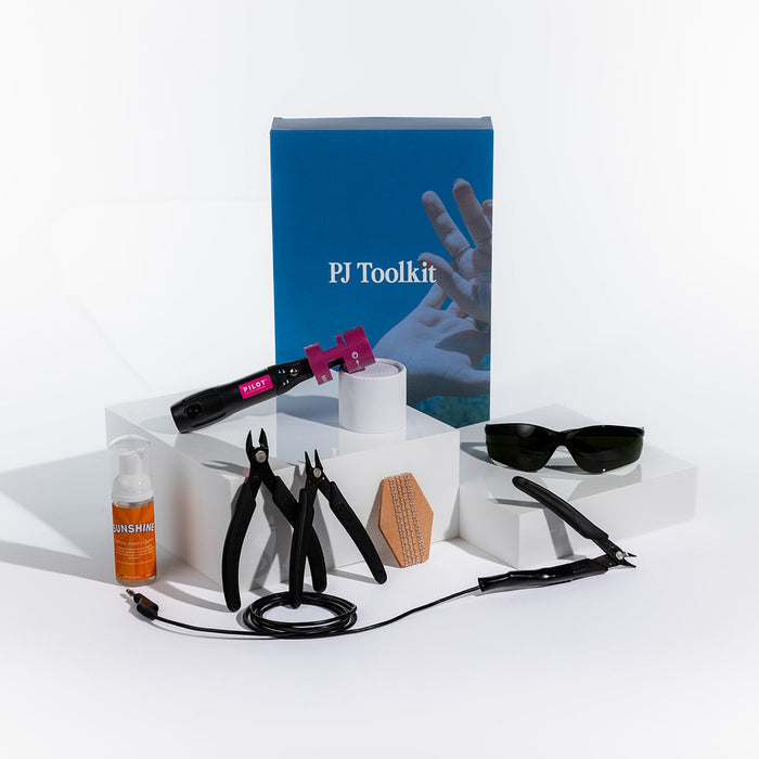 PJ Toolkit with various tools and accessories on a white background