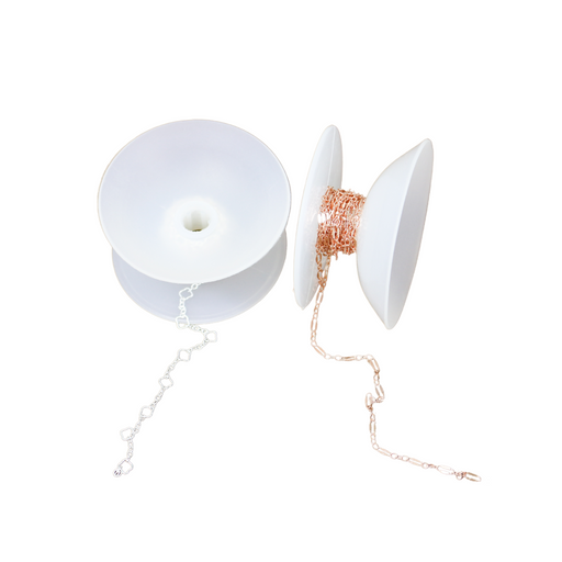 Silicone spools with permanent jewelry chain on them. One side of the silicone spool can be popped towards the other to protect the chain.