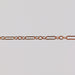 Rose gold paperclip chain on a gray background for permanent jewelry