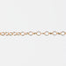 Gold filled yellow chain with round links on a white background