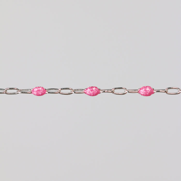 Silver chain with pink enamel on a light gray background