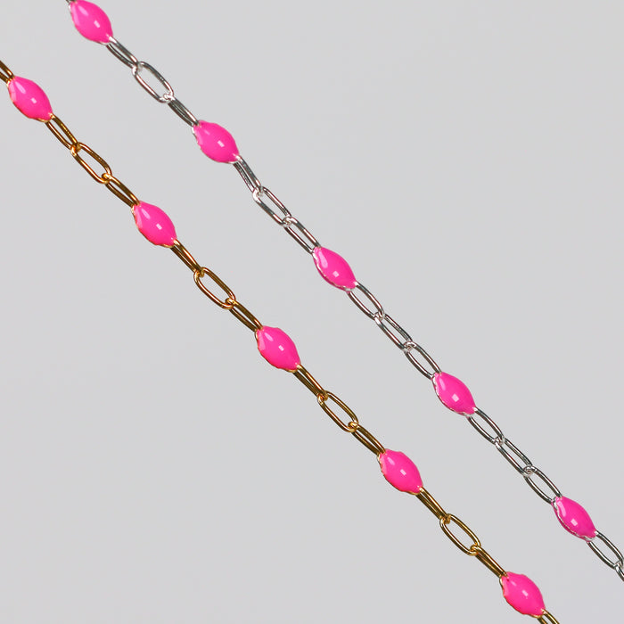 Two chains with pink enamel on a gray background