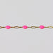 Gold chain with rose enamel on a light gray background