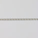 Uniform silver curb chain laying flat on a gray background