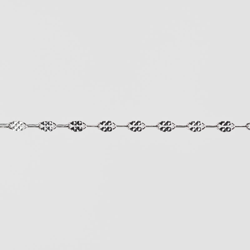 Silver chain on a light gray background